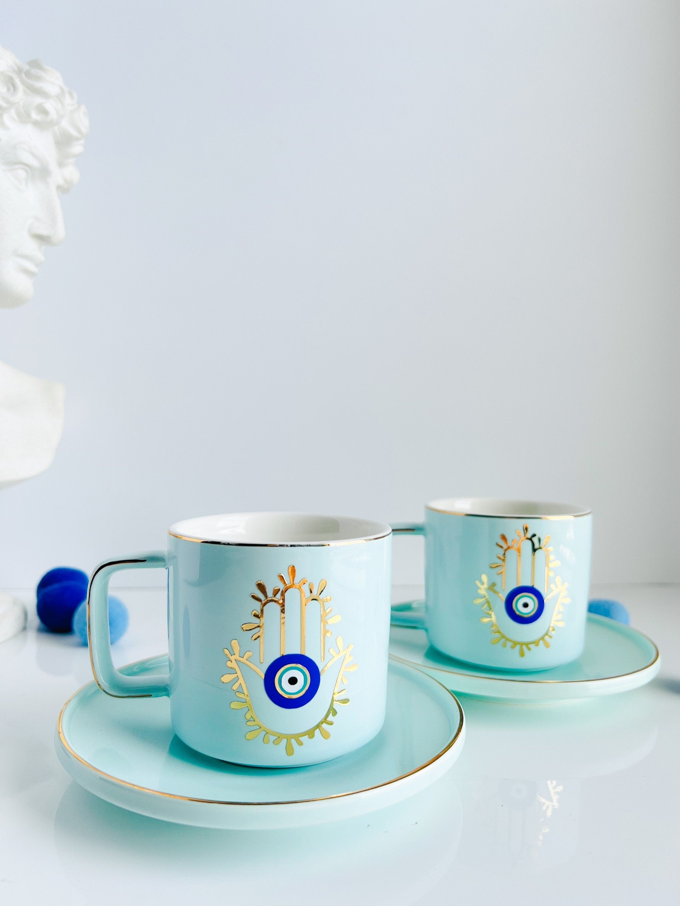 2 Evil Eye hand blown and selling hand painted espresso cups and saucers